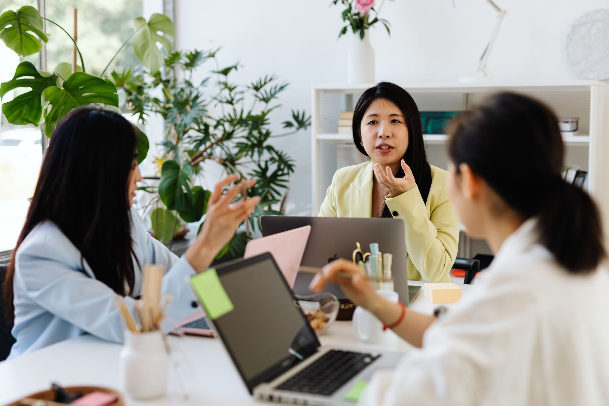 Founders and their operations partner in conversation at the office